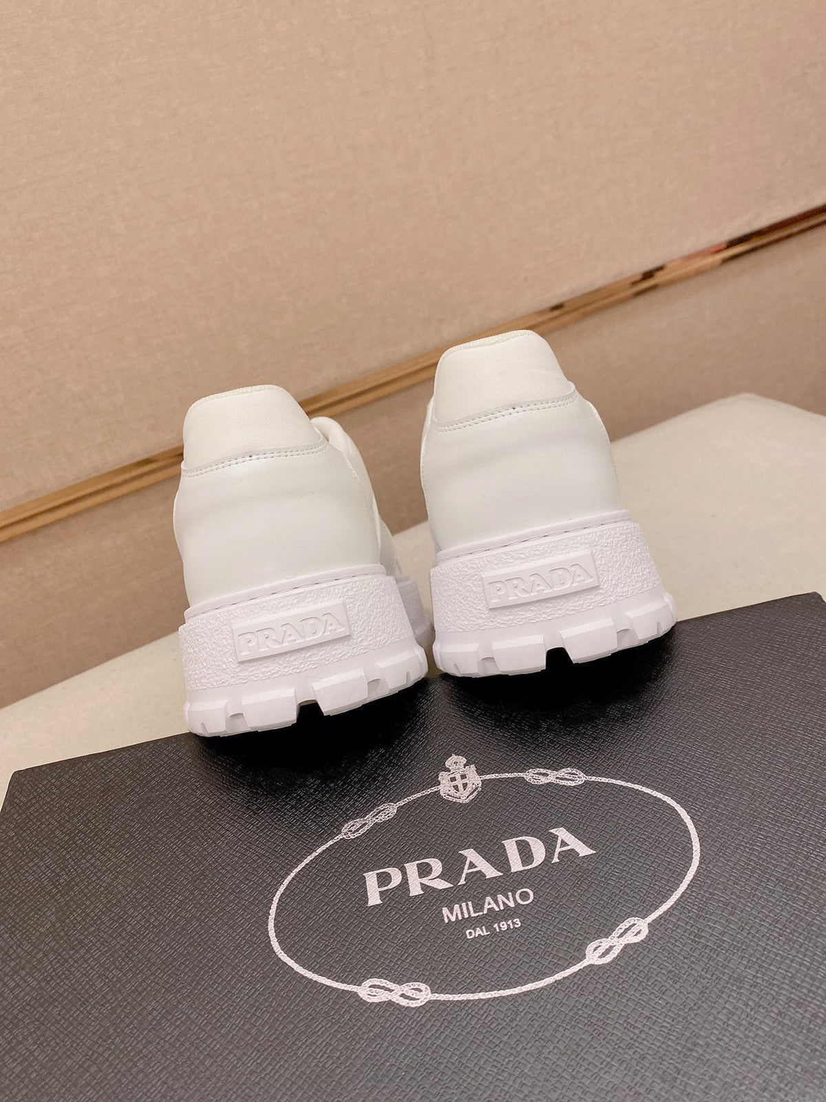 Prada Triangle Plaque Low-Top Sneakers - Treaded Rubber Sole